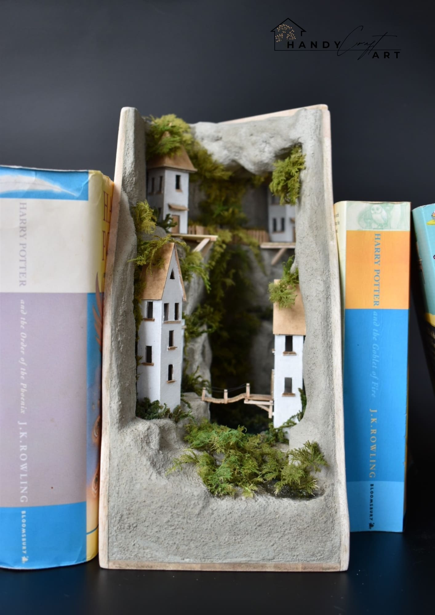 Handmade Book Nook with a miniature city on the
 Cliffs
