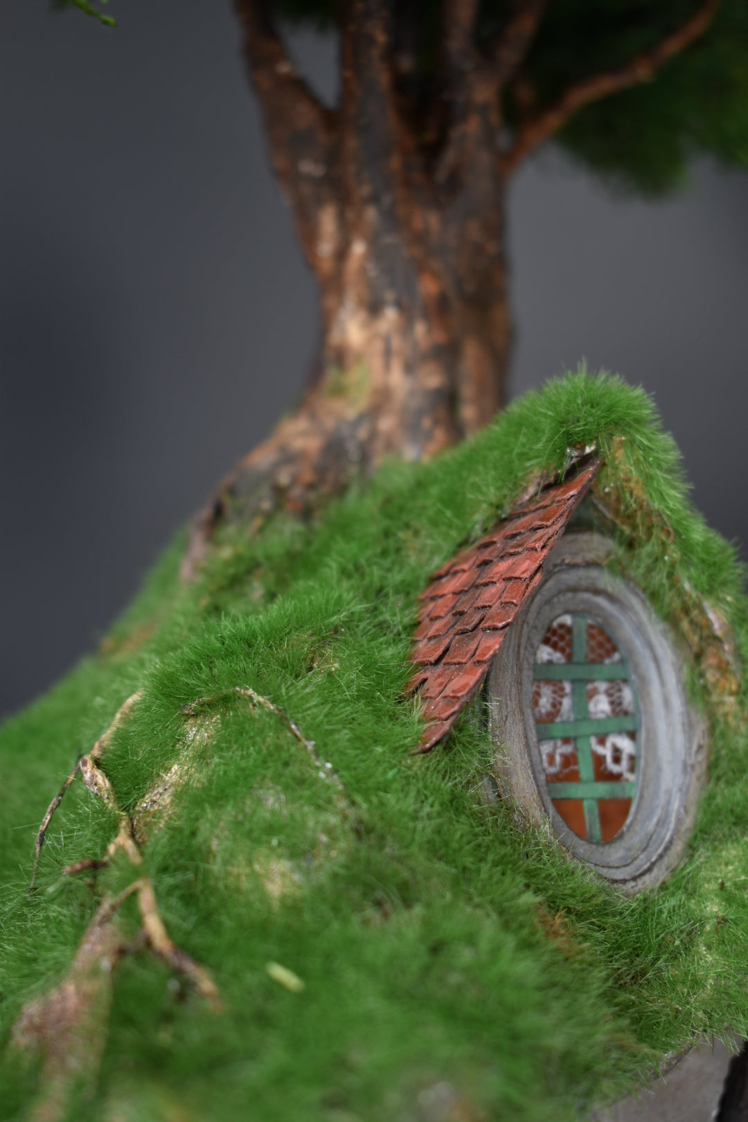 Diorama Treehouse with vibrant grass and charming oval windows, nestled under the sprawling canopy of a tree. Totally  handmade by HandiCraftArt.