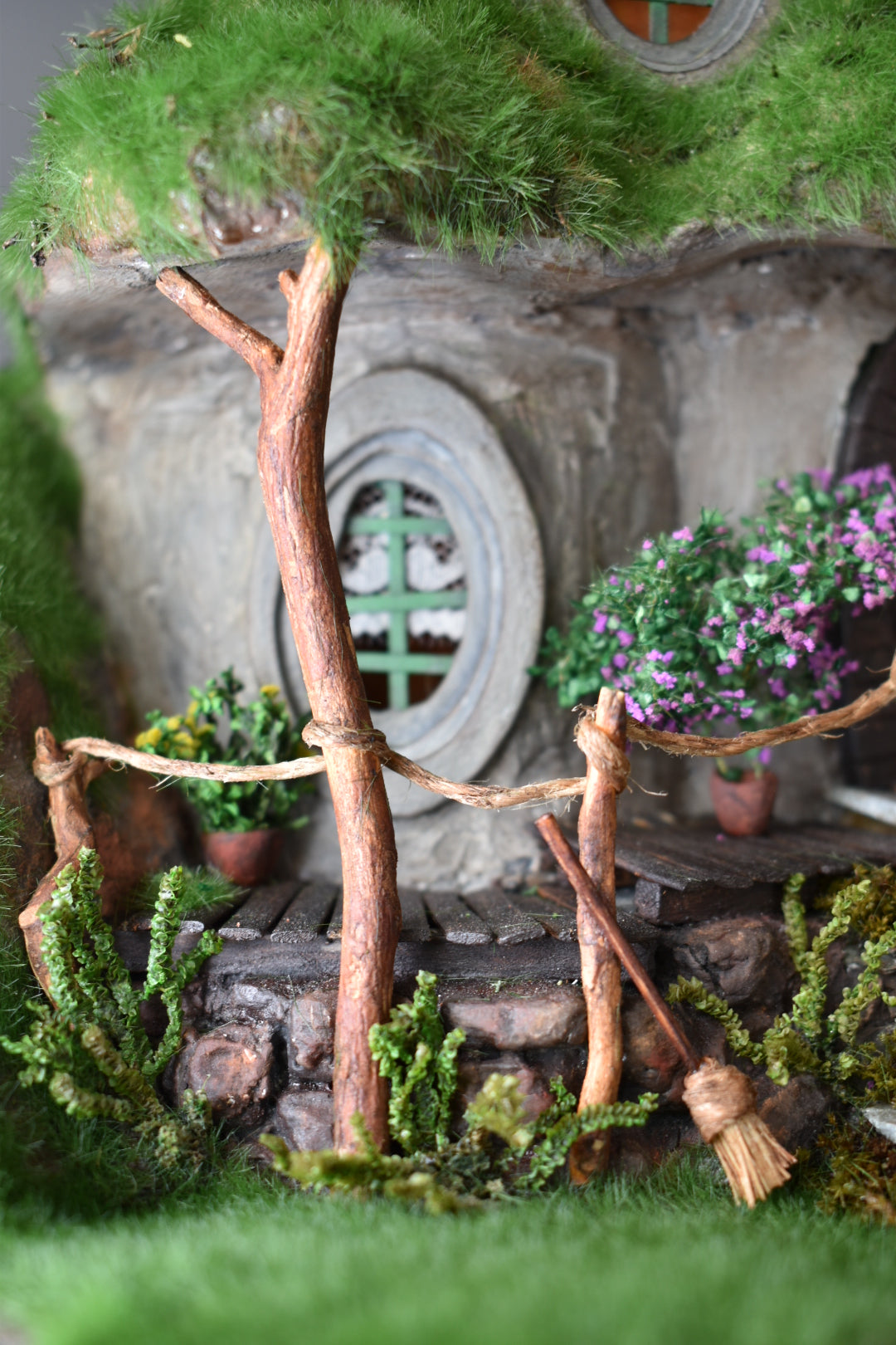 Diorama Treehouse with vibrant grass and charming oval windows, nestled under the sprawling canopy of a tree. Totally  handmade by HandiCraftArt.