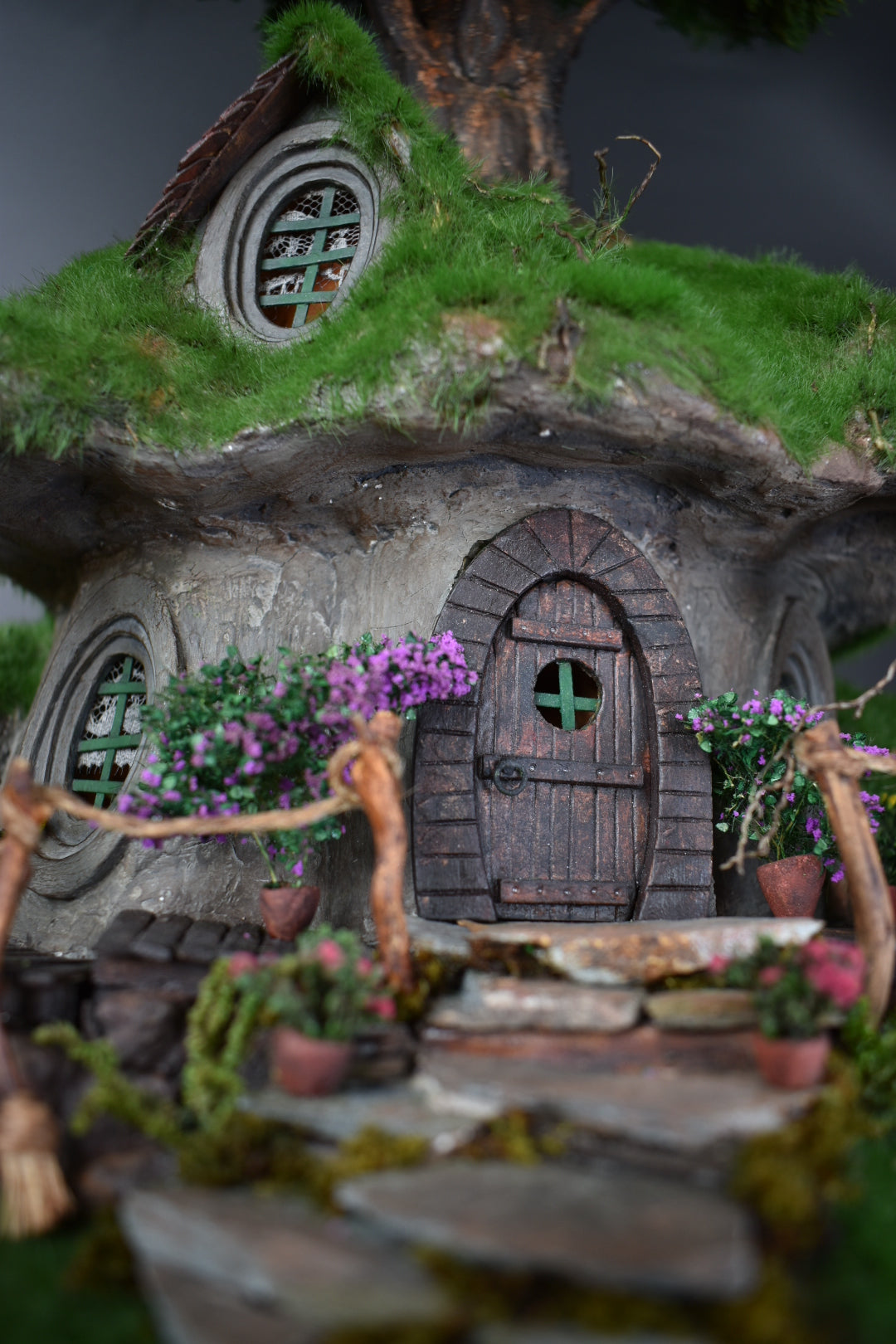 Diorama Treehouse with vibrant grass and charming oval windows, nestled under the sprawling canopy of a tree. Totally  handmade by HandiCraftArt.