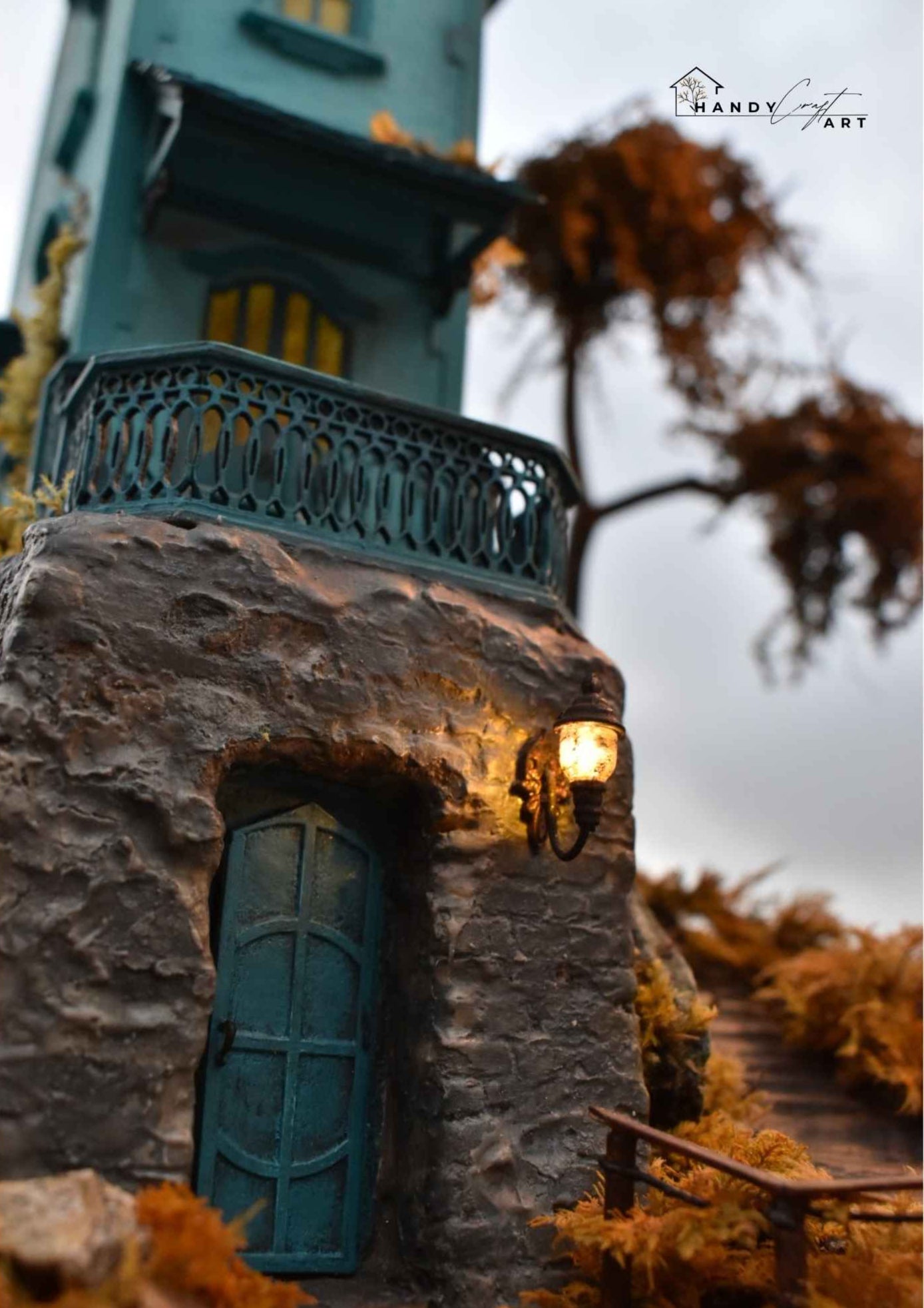Handmade fantasy diorama  by HandiCraftArtIE. Miniature house with stone foundation, surrounded by autumn foliage.
