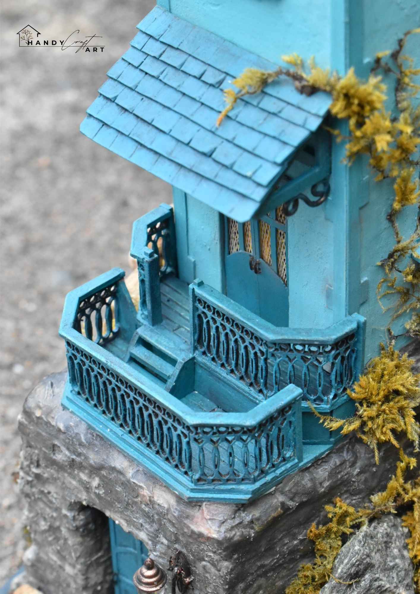 Handcrafted miniature diorama of a lonely blue house on cliff by HandiCraftArtIE.