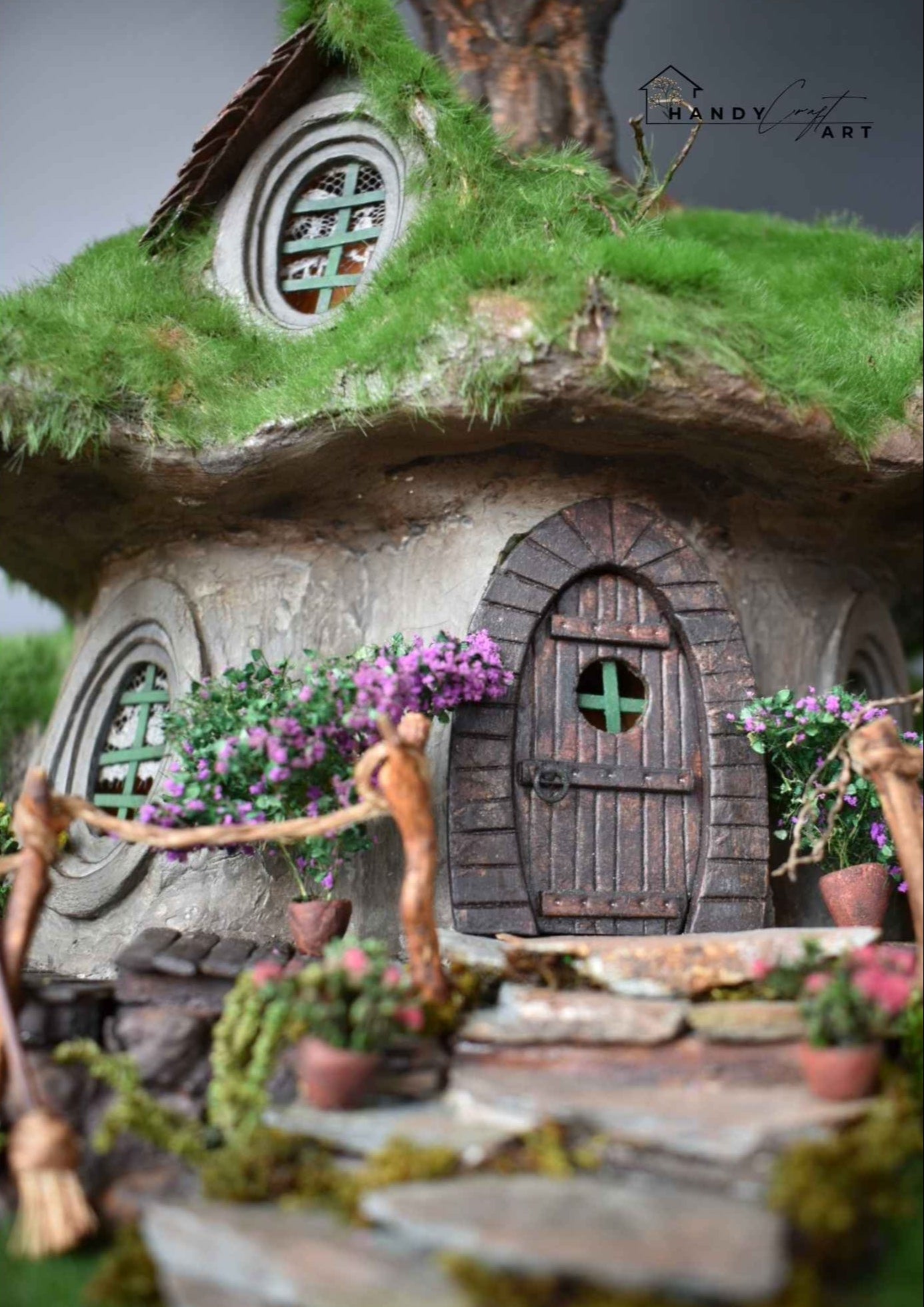 Handcrafted fantasy diorama with Miniature hobbit house, stone ladder and mossy roof by HandicraftArtie. 